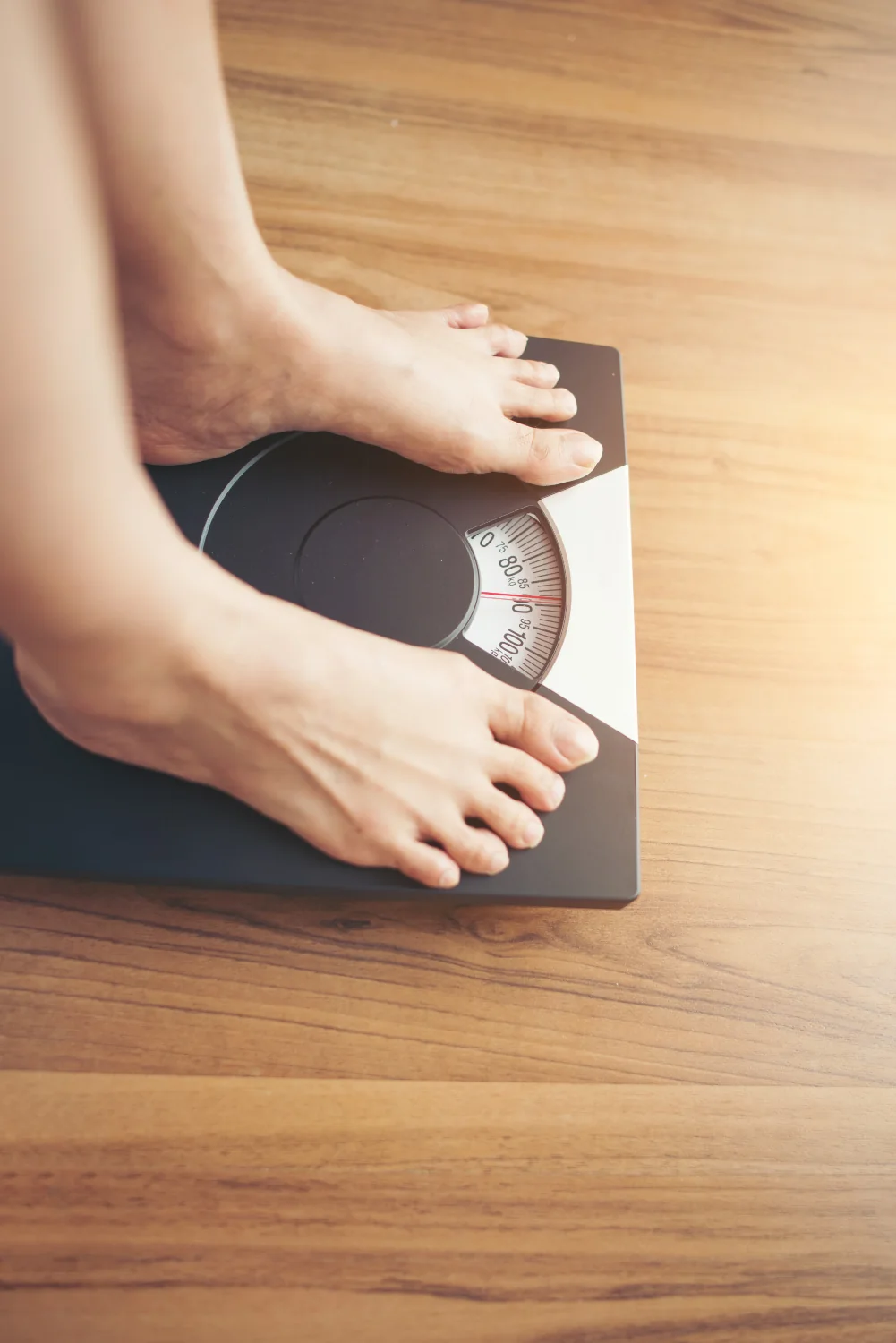 Person standing on a bathroom scale